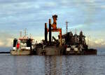 Baggereinheit bei der Arbeit im Hafen von Rostock am 06.03.24