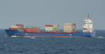 Das Containerschiff Hercules J kreuzt gerade die Fhre auf der Ostsee zwischen Sassnitz und Trelleborg.