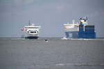 Die Scandlines Hybrid Ferry Copenhagen auf Ihrem Weg von Gedser nach Rostock-berseehafen beim Einlaufen in Warnemnde,neben an ging es fr die Finnlines Fhre Finnbreeze nach