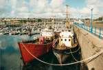Milford Haven Milford Haven war fr�her vorwiegend ein Fischereihafen. 1993 sah ich aber nur noch zwei Fischkutter am Kai. Der Rest waren Sportboote. So was nennt sich jetzt 'Marina'.