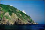 Gro�britannien Das Licht des 1913 erbauten Leuchtturmes von Sark befindet sich 65 m oberhalb des Meeresspiegels. Scan eines Dias aus dem Jahr 1993.
