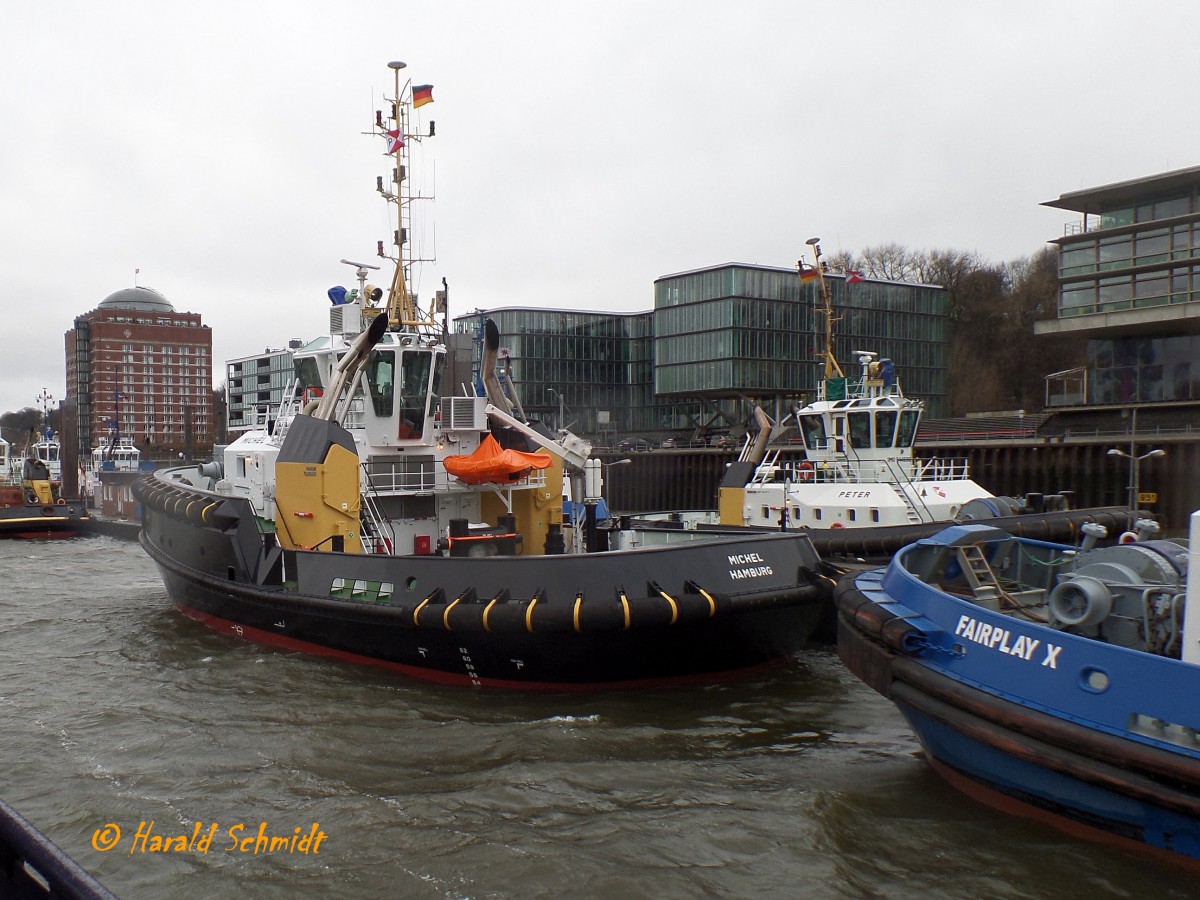 MICHEL (4) (IMO 9689081) am 21.2.2015. Hamburg, Elbe, Schlepperponton Neumühlen /
Doppelhüllen-Assistenz-Schlepper / Typ:  Damen ASD 2913 /  Lüa 28,9 m, B 13,23 m, Tg 5,4 m / 2 Diesel, Caterpillar 3516 C HD+TA/D, ges. 5.050 kW, 6.772 PS, 2 Rolls Royce Ruderpropeller US 255 FP, Prop. Ø 2,8 m,  Pfahlzug bis zu 80,3 t / Eigner: Petersen & Alpers (P&A), Hamburg  / 8.2.2015 einlaufend Hamburg, , 11.2.2015 Übernahme durch die Reederei / dieser Schlepper ist eine Neuntwicklung, P&A hat viele seiner Erfahrungen mit in diesen neuen Typ eingebracht und bekam das erste Schiff dieser Serie. Der Einsatz wird hauptsächlich im Hamburger Hafen und im Bereich Unterelbe sein. Der Neubau ist der stärkste Schlepper, der je für P&A gebaut wurde.
