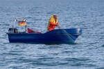 Fischer bei der Netzkontrolle vor Mukran mit SAS 58.