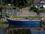 Wohl eines der kleinsten Fischereifahrzeuge im Hafen von Zempin am Achterwasser. 02.07.2012  gegen 11.07 Uhr aufgenommen (das nicht unbedingt zum Bild passende Tandem gehrt dem Fotografen)