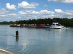 Containerschiff  Heros , rheinabwrts hinter Marckolsheim, das 183m lange Schiff fhrt fr die H&S Container Line Duisburg, Juni 2013 