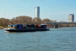 Container-Schiff  Aragon  auf dem Rhein, im Hintergrund Telekom-Tower und UN-Hochhaus in Bonn - 09.03.2014