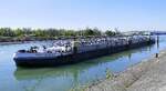 TMS STADT M�NCHEN ENI 04804110, rheinaufw�rts in Wartestellung vor der Staustufe Vogelgr�n/Elsa�, April 2026