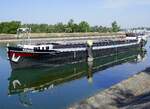 GMS REGIUS ENI 02311365, rheinaufw�rts in Warteposition vor der Staustufe Vogelgr�n/Elsa�, Juni 2026