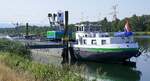 Arbeitsschiff MARITIEM, ankert in Breisach am Altrhein oberhalb vom Kulturwehr, Heckansicht, Juni 2026 
