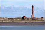 Der 54 m hohe Leuchtturm von Norderney ist seit dem 01.10.1874 in Betrieb. ber 252 Stufen gelangt man zur Galerie, die einen herrlichen Blick ber die Insel und das Wattenmeer bietet. Aufnahmedatum: 04.04.2007