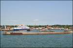 Der Hafen von Gedser, links die Fhre  Mercandia VIII  der Reederei  HH-Ferries , am 07.07.13 an Bord der einlaufenden Fhre aus Rostock fotografiert.