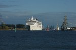 Am Abend des 14.08.2016 verlässt die MSC Opera Warnemünde in Richtung Visby in Schweden. Am Anleger liegen die Fregatte Schleswig Holstein und das Segelschulschiff Kruzenshtern. Auch die Brigg Mercedes ist zu sehen.
