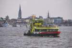 HAMBURG, 22.04.2012, Fährschiff Oortkaten mit Landungsbrücken-Kulisse im Hintergrund