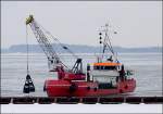  Die  AASE MADSEN  (IMO-Nummer- 7731751) bei  Baggerarbeiten vor dem neuem Sdhafen.  (Stralsund am 16.03.06)