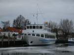 Das Fahrgastschiff  WAPPEN VON BREEGE  im vereisten Hafen von Breege am 26.Dezember 2012.