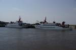 Im Hafen von Neuharlingersiel treffen sich die beiden grten Schiffe der Nordseebad (NSB) Spiekeroog GmbH. Links im Bild ist die 46,8 Meter lange und 10,0 Meter breite Spiekeroog I (IMO 8016897) zu sehen. Dieses Schiff wurde 1981 von der Julius Diedrich Schiffswerft (Oldersum) fr die NBS Spiekeroog gebaut und bietet 750 Fhrgsten platz. Rechts im Bild ist die Spiekeroog II (IMO 8024143) zu sehen. Aufgenommen am 26.07.2008