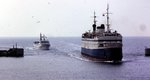 M/S Theodor Heuss der DB in den achtziger Jahren einlaufend Rödby Havn (DK), dainter ein  Butterschiff .