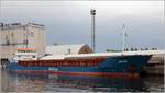 Die 2004 gebaute ARLAU (IMO 9192650) liegt am 09.05.2019 im Hafen von Stettin. Sie ist 87,97 m lang und 12,9 m breit, hat eine GT/BRZ von 2.461 und eine DWT von 3.701 t. Heimathafen ist St. John's (Antigua and Barbuda).