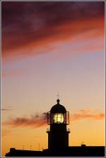 Der Leuchtturm am Cabo So Vicente im Licht der untergehenden Sonne. Scan eines Dias aus dem Frhjahr 1998.