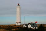 Blåvandshuk Fyr. Der 39 m hohe und im Jahre 1900 erbaute Leuchtturm ist der westlichste Leuchtturm von Dänemark.  Er steht auf der Landzunge Blåvand Huk und warnt die Seeschifffahrt vor dem Horn Rev; 09.03.2013