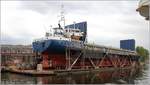 Die 1990 gebaute OLZA (IMO 8919843) liegt in Stettin im Schwimmdock. Sie ist 90 m lang und 10 m breit, hat eine GT/BRZ von 2.292 und eine DWT von 2.690 t. Heimathafen ist Limassol (Zypern). Frühere Namen: CHRISTOPHER, FAIRDEAL, SUN LEADER.