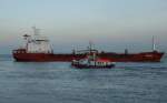 Der Tanker IONIAN (IMO: 9367255) nach der Ausfahrt aus der NOK-Schleuse Brunsbttel Richtung Elbe mit einem Lotsenversetzer im Vordergrund.