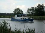 WSP 1 der Wasserschutzpolizei Potsdam/Brandenburg während eines Regenschauers im EHK b. Kader Schleuse auf Talfahrt.