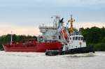 Schiffsbegegnung im Nord-Ostsee-Kanal an der Weiche Fischerhütte Schlepper Taucher O. Wulf 8 Flagge:Deutschland Länge:23.0m Breite:7.0m passiert den Tanker Christina IMO-Nummer:9118496 Flagge:Norwegen Länge:123.0m Breite:18.0m Baujahr:1996 Bauwerft:Aukra Industrier,Aukra Norwegen aufgenommen am 18.05.14