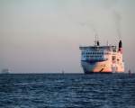 Stena Line Fhre Skane auf dem Weg von Trelleborg nach Rostock berseehafen beim Einflaufen im Hafen von Warnemnde am 17.05.2014 um 05:29 Uhr,im Hintergrund kam schon die Aidamar.