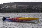 MARTIN, ein farbenfroh lackiertes  cigarette -powerboat mit 4 Auenbordern liegt in der St. Paul's Bay. 19.03.2009