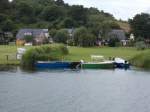 Ruder-und Motorboote auf der Moritzdorfer Uferseite am 02.Juli 2014.Das Moritzdorf liegt bei Baabe.