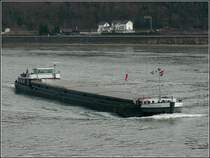 Das Frachtschiff  TRAVERS�E  auf dem Rhein bei Oberwesel unterwegs am 19.03.2010. Schiffsdaten: Bj 1956, L 86 m, B 8,22 m, 1300 T, Euronr 02318350.