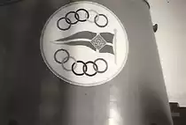 AL-MALIK SAUD AL -AWAL (IMO 5500760) (Schornsteinmarke Olympic Maritim (Aristoteles Onassis) am 3.6.1954 Stapellauf bei Howaldtswerke Hamburg, Bau-Nr. 883,  / (Scan vom Foto, von für Taufgäste frei zugänglichem Gelände)
Turbinen-Tankschiff (damals der größte Tanker der Welt)  / Lüa 236,4 m, B 29,2 m / Tragfähigkeit: 50.000 t / Eigner: Olympic Maritim (Aristoteles Onassis) / 9.6.1966 in Salinas (Venezuela) brannte das Achterschiff nach einer Explosion im Maschinenraum aus, per Schlepp nach Teneriffa (Kanaren) um das restliche an Bord befindliche Rohöl zu löschen, Dezember 1967 per Schlepp nach Hamburg, Achterschiff Abbruch, Vorderschiff Umbau zum Öllagerschiff, per Schlepp in den Golf