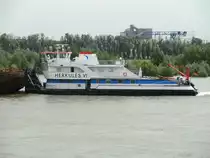 Das Schubboot Herkules VI, hier schon in den Farben und der Beflaggung der Imperial Reederei. Das Fote wurde am 16.6.2012 vor der Rheinbrücke in Wesel aufgenommen.